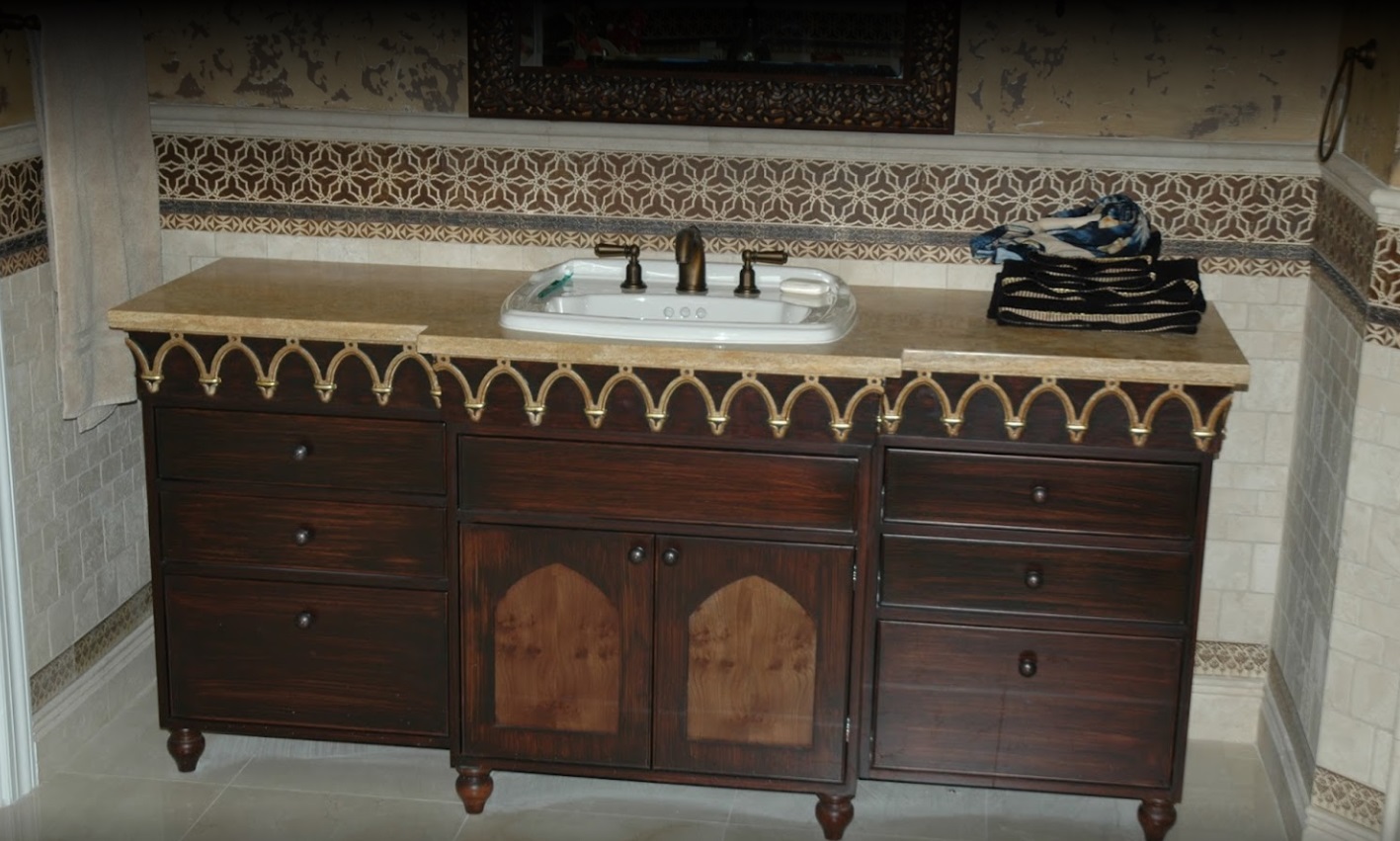 Decorative vanity cabinet with carved trim