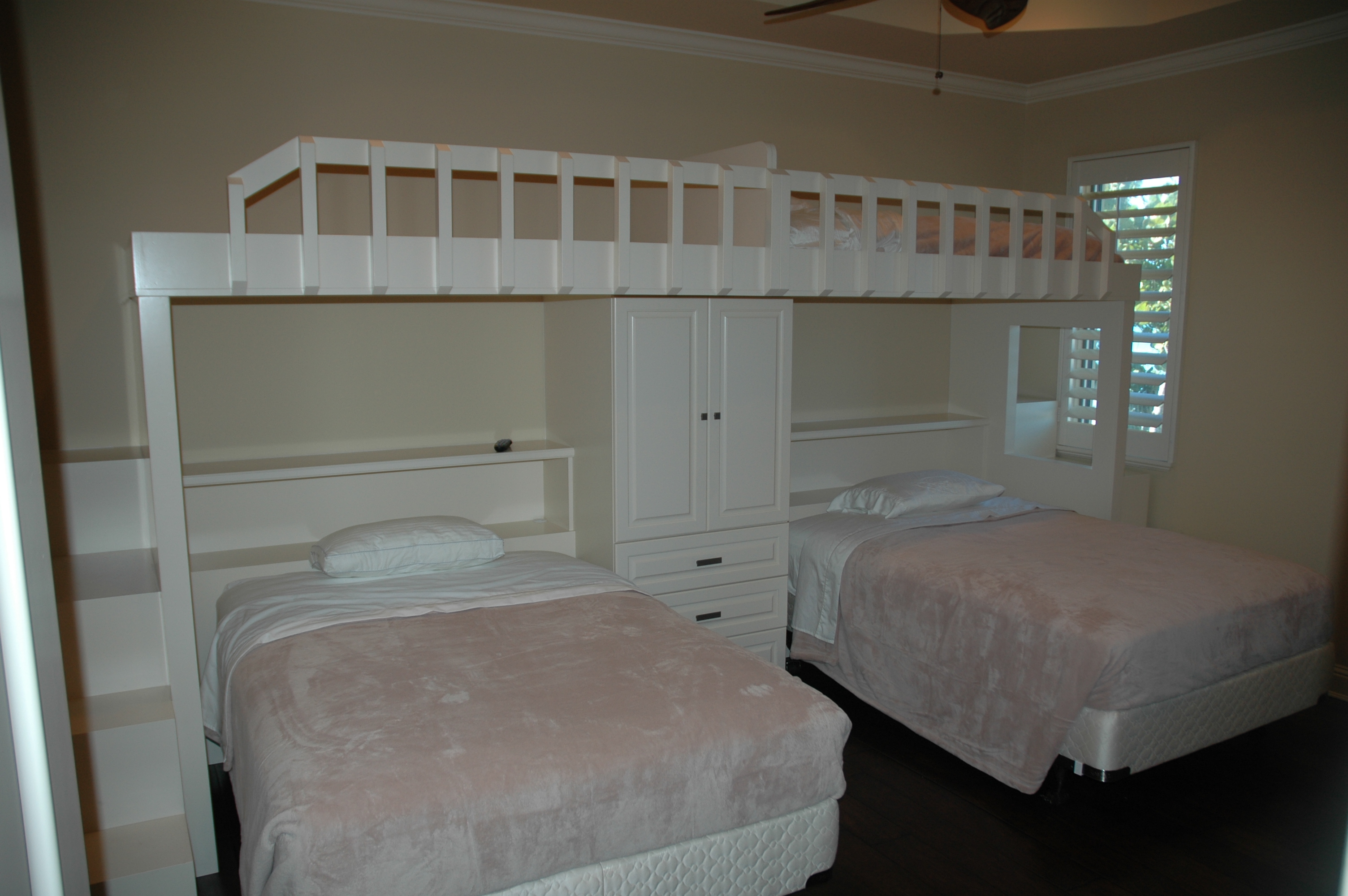 Built-in bedroom group with storage and loft beds